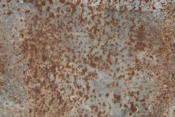 rusty stains on the surface of a metal sheet.