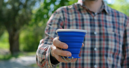 zero waste concept, young male use reusable coffee cup	