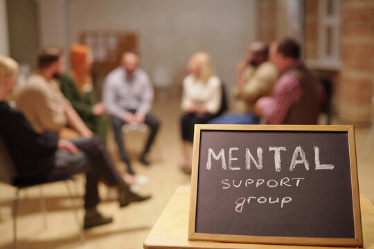 Small blackboard saying about mental support group against patients