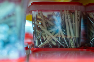 Group of plastic containers with nails sold in hardware store