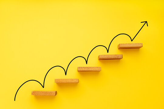 Rising arrow on staircase on yellow background. Growth, increasing business, success process concept