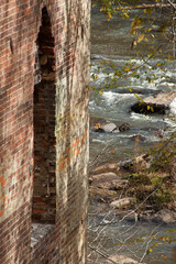 Cascading river framed by old brick ruins