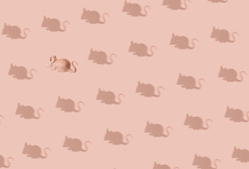 
Seamless pattern with mice, pastel pink background, creative individual against group concept.