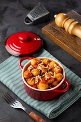 Gnocchi with tomato sauce and grated Parmesan cheese.