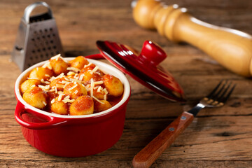 Gnocchi with tomato sauce and grated Parmesan cheese.