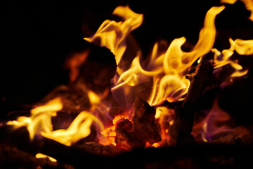 Close-up of flames of fire and burning wood in the fireplace