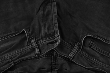 Pocket details of black jeans. Sewing details of black jeans.