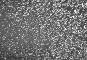 Abstract background, raindrops on glass.