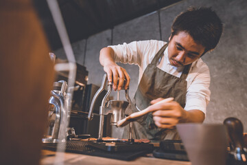 professional barista making hot drink of a fresh coffee in vintage cafe, cup of brown aroma hot espresso with milk, beverage caffeine for morning, coffee bean and breakfast background