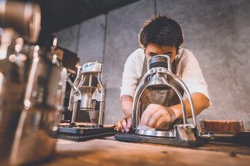 professional barista making hot drink of a fresh coffee in vintage cafe, cup of brown aroma hot espresso with milk, beverage caffeine for morning, coffee bean and breakfast background