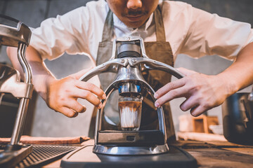 professional barista making hot drink of a fresh coffee in vintage cafe, cup of brown aroma hot espresso with milk, beverage caffeine for morning, coffee bean and breakfast background