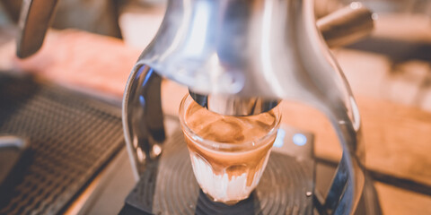 professional barista making hot drink of a fresh coffee in vintage cafe, cup of brown aroma hot espresso with milk, beverage caffeine for morning, coffee bean and breakfast background