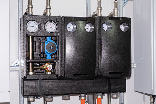 Heating thermoregulation system. Pump and sensors. Close-up on a white background. Business concept. Modern design.