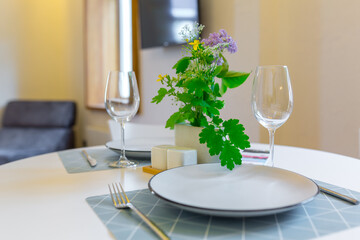 Interior photography, loft style, small apartment with warm light and dark kitchen