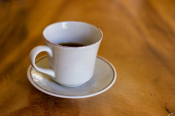 Cup of organic coffee on a wooden table at 