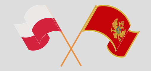 Crossed and waving flags of Poland and Montenegro