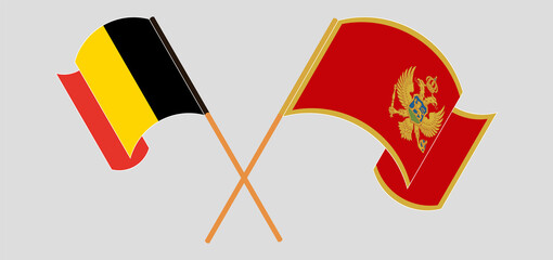 Crossed and waving flags of Belgium and Montenegro