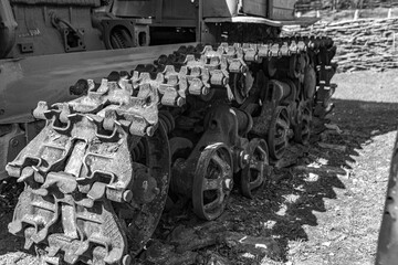 Old vintage tractor tracks and wheels.
