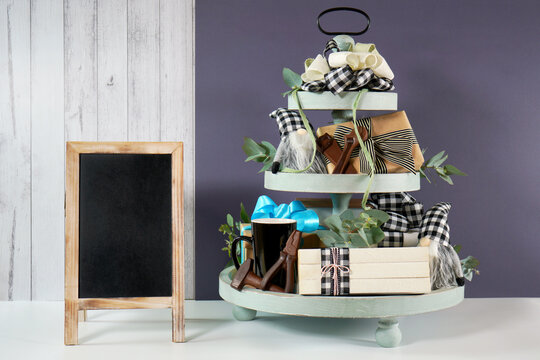Father's Day or masculine birthday. Chalkboard sign with on-trend farmhouse aesthetic three tiered tray decor filled with gifts, cute black plaid gnomes, and farmhouse style stack of books mockup.