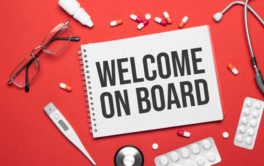 The welcome on board medical supplies on a notebook on a medical theme. Doctor's workplace.