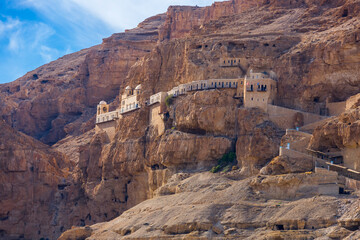 The Monastery of the Temptation on the red rocks. The Mount of Temptation in Jericho, Palestine....