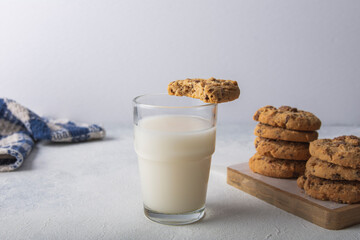 chocolate chip cookies with a glass of milk