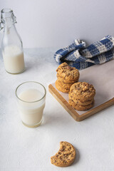 chocolate chip cookies with a glass of milk