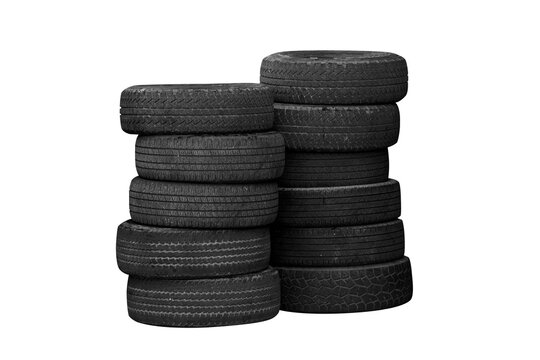 A pile of used car tires stacked in a rubber tower