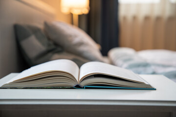 cozy bedroom detail focus on open book