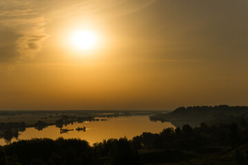 Obraz premium sunset over the river