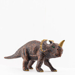 plastic toy dinosaur isolated on white background