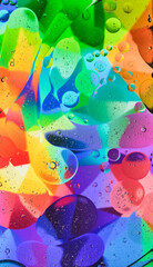 Abstract colorful liquid water splash and bubbles background. Macro photography. Vertical
