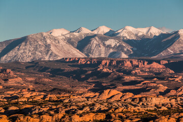 Petrified Sand Dunes at The Foot of The Snow Capped La Sal Mountains , Arches National Park, Utah, USA
