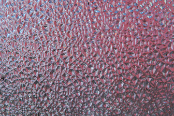 refreshing background: imitation of dew on a transparent surface, color toning, short focus.