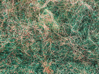 macro image of the fibers that make up a kitchen sponge