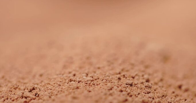 Powder flowing as sand like object closeup