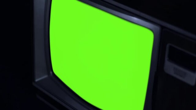 80s Television Green Screen. Close Up. Zoom In. You can replace green screen with the footage or picture you want. You can do it with “Keying” effect in After Effects. 4k Resolution. 