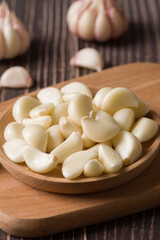 Garlic Cloves and Garlic Bulb on vintage wood background