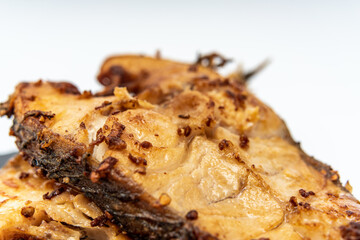 Fried mackerel on a white background