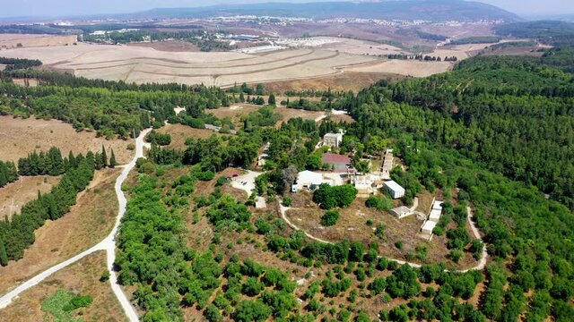 Aerial Shot Of Residential Buildings Amidst Trees At Kibbutz, Drone Panning Over Land - Megiddo, Israel