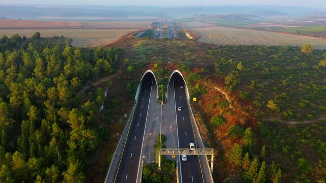 Aerial Shot Of Vehicles Moving On Bridge, Drone Over Road - Megiddo, Israel