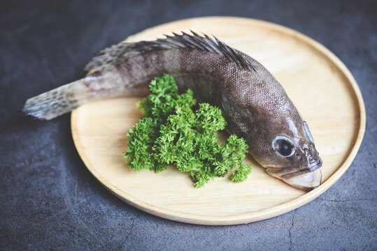 Grouper Fish On Wooden Plate, Fresh Raw Seafood Fish For Cooked Food