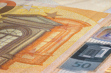 Macro close up on the design surface of 50 euro notes. Banknotes of the European Union. Wallpaper...