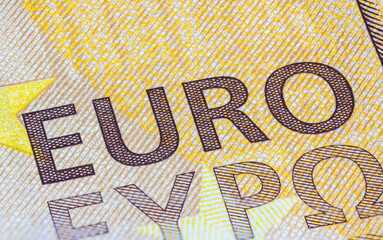 Fragment part of 50 euro banknote close-up with small brown details. Closeup of the fifty euro banknote, Euro currency money. Oblique detailed macro view. New Europe paper money. European Union cash