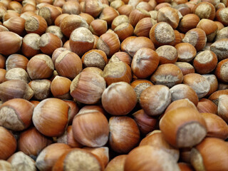 unpeeled hazelnuts. background and texture. agriculture. supermarket