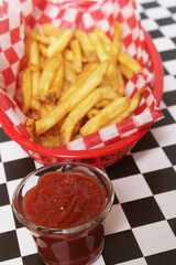 French Fried Potatoes in Retro Cafe With Checkered Paper