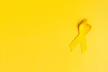 Yellow Ribbon on yellow background for supporting people living and illness. July Sarcoma cancer,...