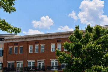 Mixed use condominium apartment building with balconies in an urban setting