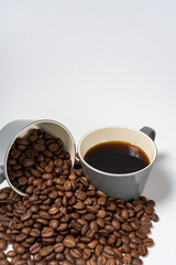 Coffee beans and coffee on a white background