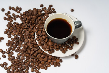 Coffee beans and coffee on a white background